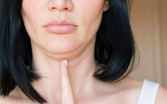 Woman pointing to her double chin